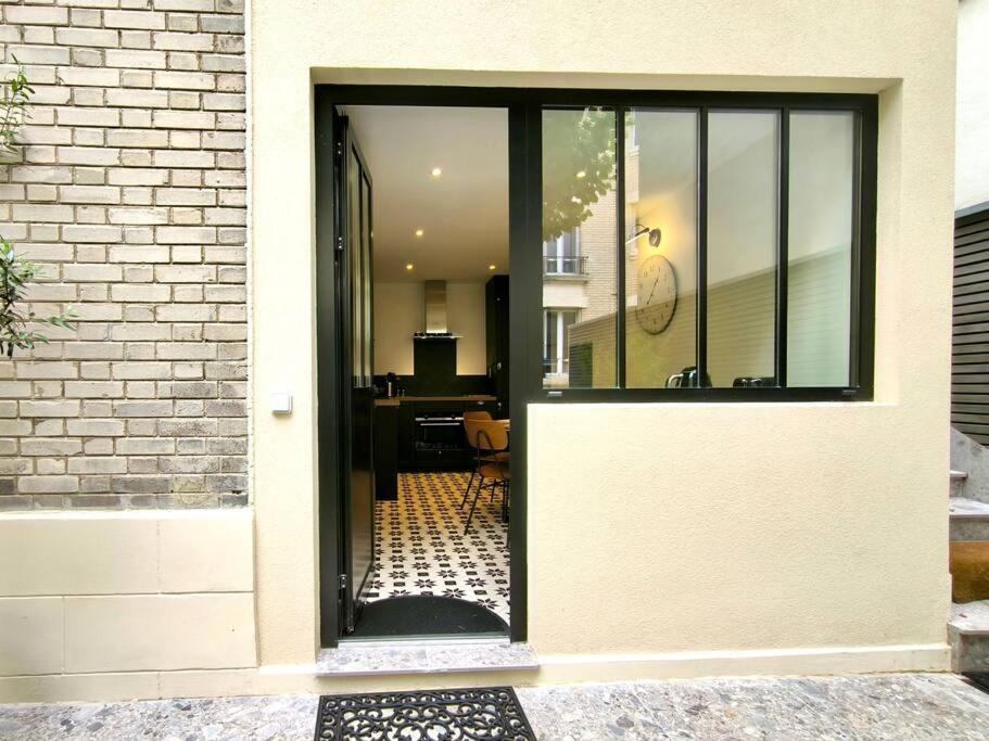 Montmartre En Rez-de-jardin Apartment *